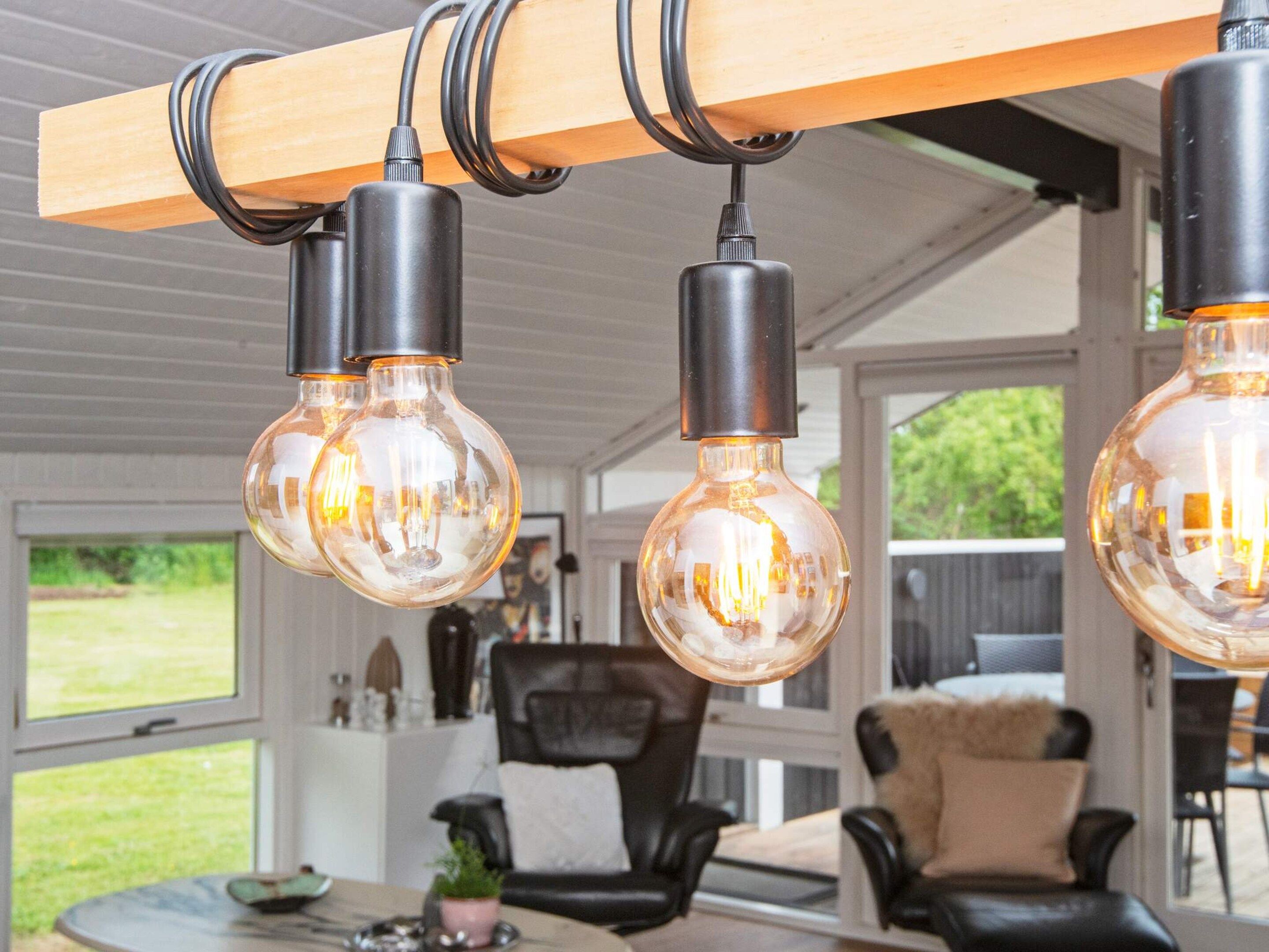 A ceiling with three exposed bulb fixtures.