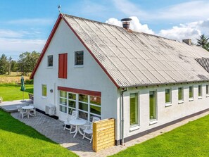 A white building with a red roof and multiple windows. - Holiday Home in HjÃ¸rring (Hjørring)