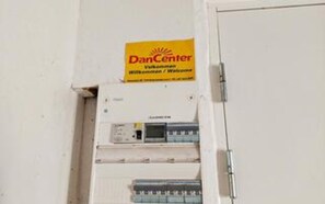 A DanCenter sign above an electrical panel.