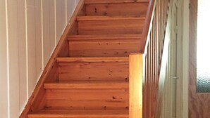 A wooden staircase leading to an upper floor. - 6 Person Holiday Home in Storsteinnes (Balsfjord)