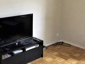 Cozy retreat with a flat-screen TV, DVD player, and entertainment unit.