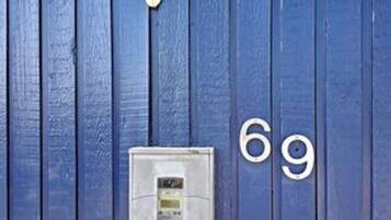 A blue door with the numbers '69' indicating a room number.