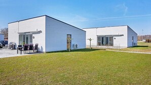 A modern two-story building with a flat roof and large windows. - 6 Person Holiday Home in Nexo (Nexø)