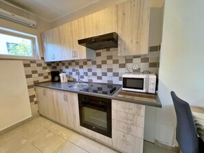 Fridge, microwave, stovetop, coffee/tea maker