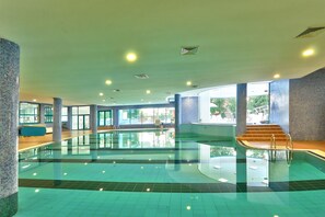 Indoor pool, seasonal outdoor pool, pool umbrellas, sun loungers