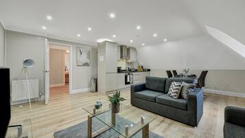 Elite Apartment | Living area | 43-inch Smart TV with cable channels, TV, Netflix