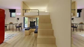 Ein modernes Interieur mit einer Treppe, die zu einem Schlafbereich im Obergeschoss führt, einem Essbereich mit Stühlen und einem Telefon an der Wand.