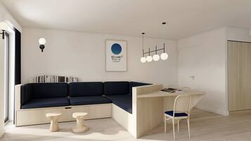 A modern living space with a built-in L-shaped sofa, a wooden desk, and a white door.