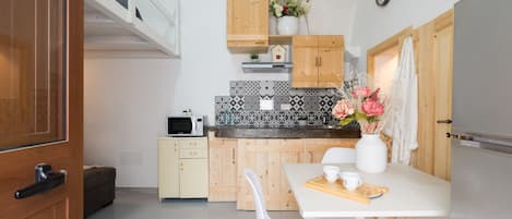 Apartment | Private kitchen | Full-size fridge, stovetop, cookware/dishes/utensils