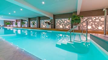 Indoor pool, open 8:00 AM to 10:00 PM, pool loungers