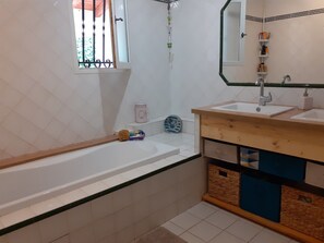 Bathtub, hair dryer, towels