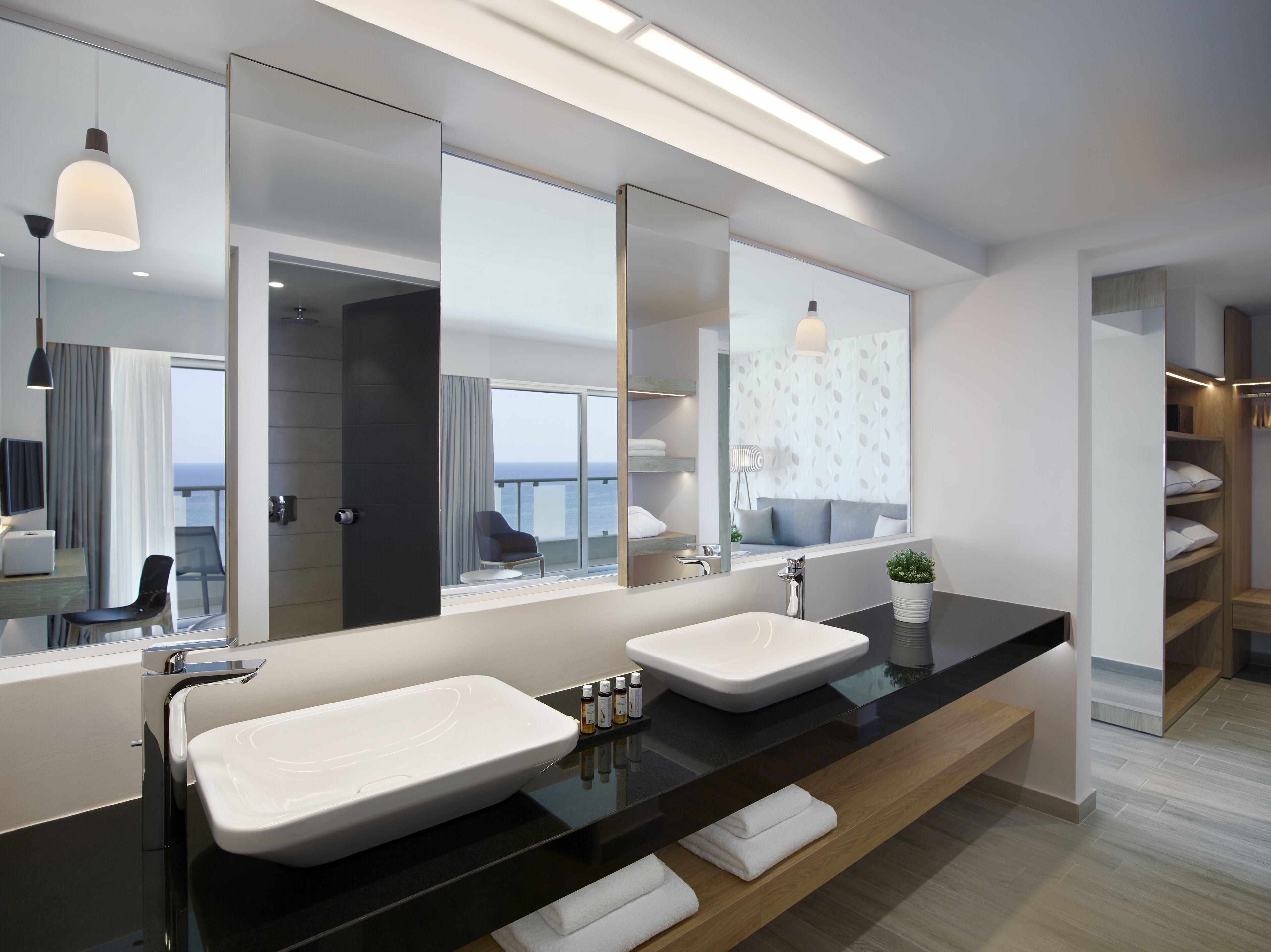 suite with sea view | bathroom | hair dryer, towels, soap, shampoo