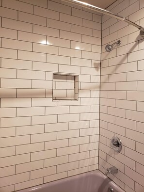 Combined shower/bathtub, hair dryer, towels, soap