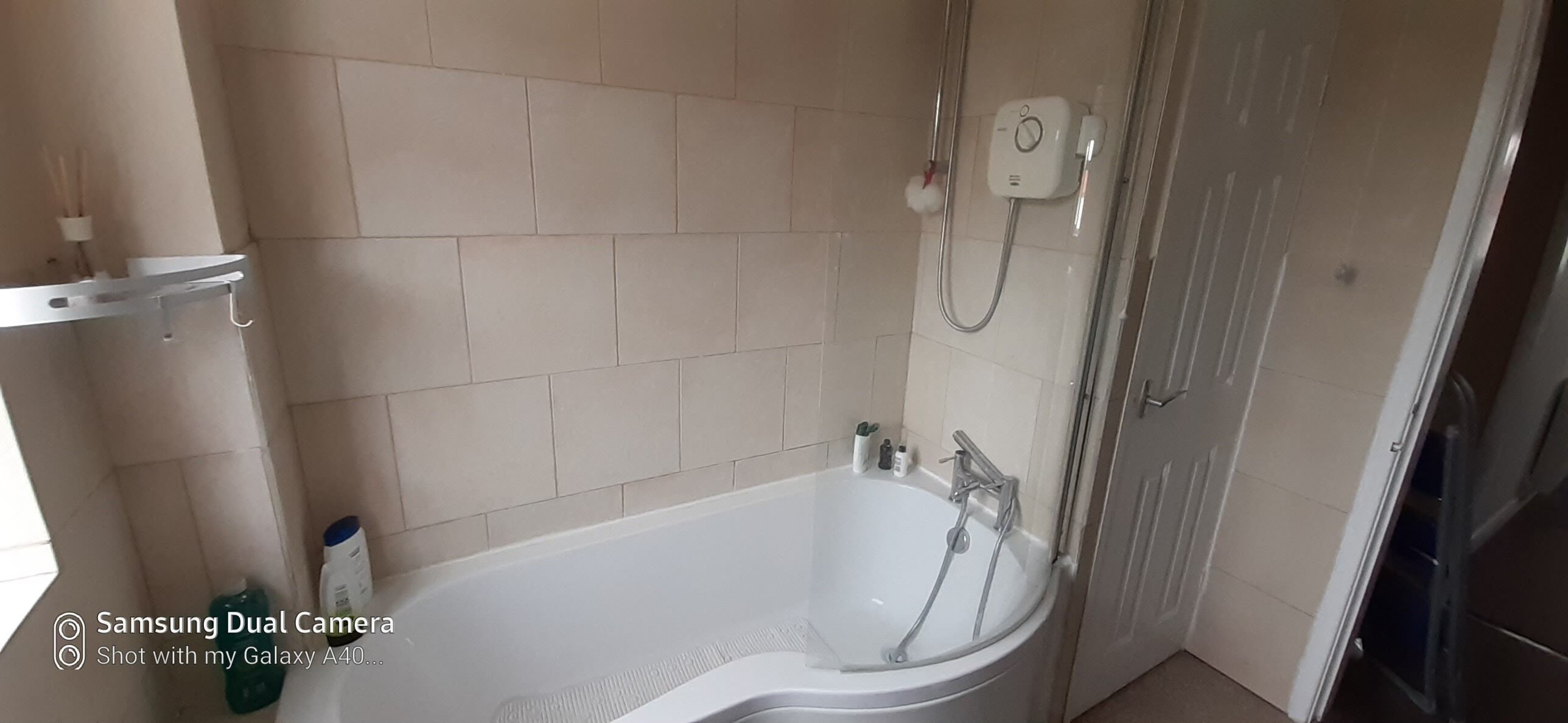 A bathroom with a bathtub, a shower, and a toilet.