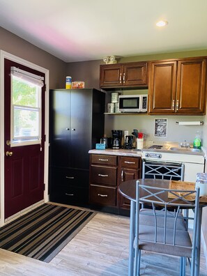 Fridge, microwave, stovetop, coffee/tea maker