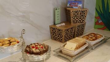 A buffet with various desserts and snacks.