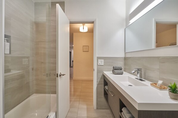 Bathtub, hair dryer, towels, soap