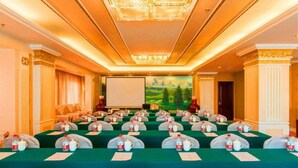 A conference room with a long table, chairs, and a projector screen. - Bingtuan Building (Beijing)