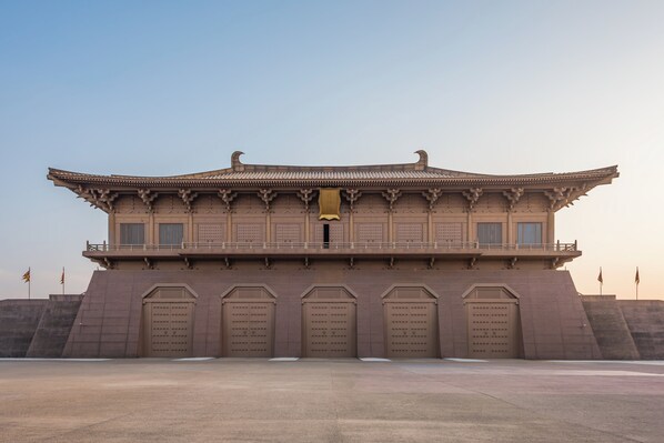 A large, traditional building with a symmetrical facade, multiple doors, and a central balcony. - Intercontinental Xi an North (Xi'an)