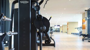 A gym with various exercise machines, including a cable machine and weight stacks. - Intercontinental Xi an North (Xi'an)