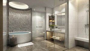 A modern bathroom with a freestanding bathtub, a glass-enclosed shower, and a vanity with a mirror. - Holiday Inn Chengdu Airport (Chengdu)