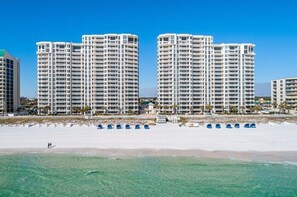 On the beach, sun loungers, beach towels