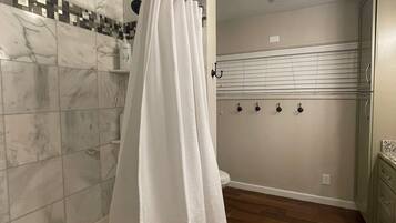 Combined shower/tub, hair dryer, towels, soap