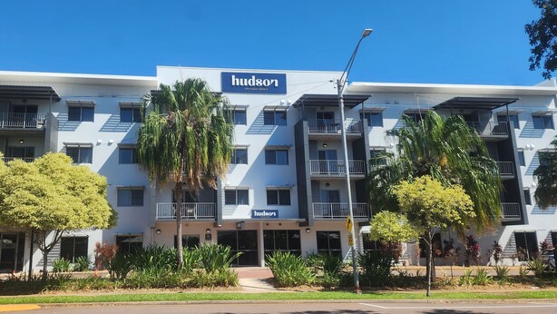 A modern hotel with a 'Hudson' sign, multiple balconies, and a landscaped front yard. - Hudson Parap (Parap)