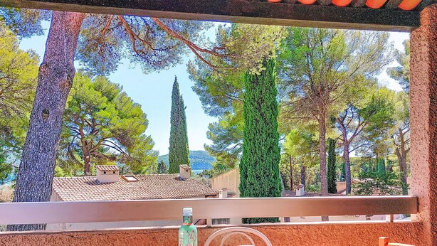 A terrace with a table set for breakfast, overlooking a scenic view of trees and a distant landscape. - Les Hauts du Port by Interhome (Saint Cyr sur mer Les Lecques)