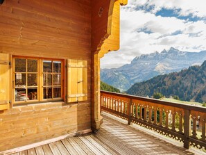 A wooden cabin with a balcony overlooking a mountainous landscape. - Godfrey by Interhome (Les Crosets)