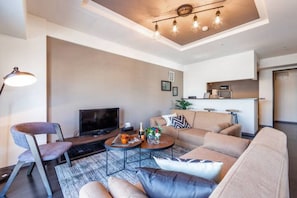 Apartment, Non Smoking | Living area | Flat-screen TV