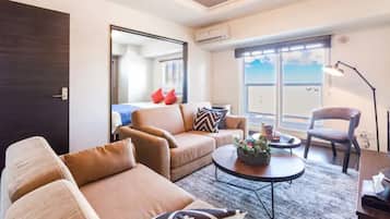 Apartment, Non Smoking | Living area | Flat-screen TV
