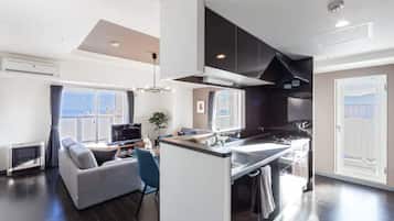 Apartment, Non Smoking | Living area | Flat-screen TV