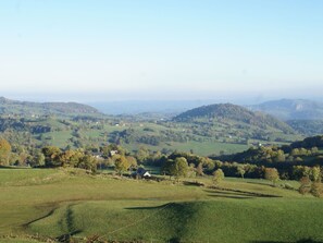 Surrounded by rolling hills and lush greenery, this serene landscape offers a peaceful retreat.