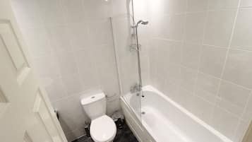 Apartment, 1 King Bed with Sofa bed | Bathroom | Combined shower/tub, deep soaking tub, towels