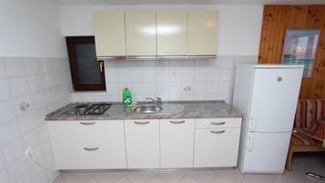 Apartment, 2 Bedrooms, Balcony | Private kitchen | Fridge, microwave, stovetop, coffee/tea maker