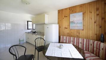 Apartment, 2 Bedrooms, Balcony | Private kitchen | Fridge, microwave, stovetop, coffee/tea maker
