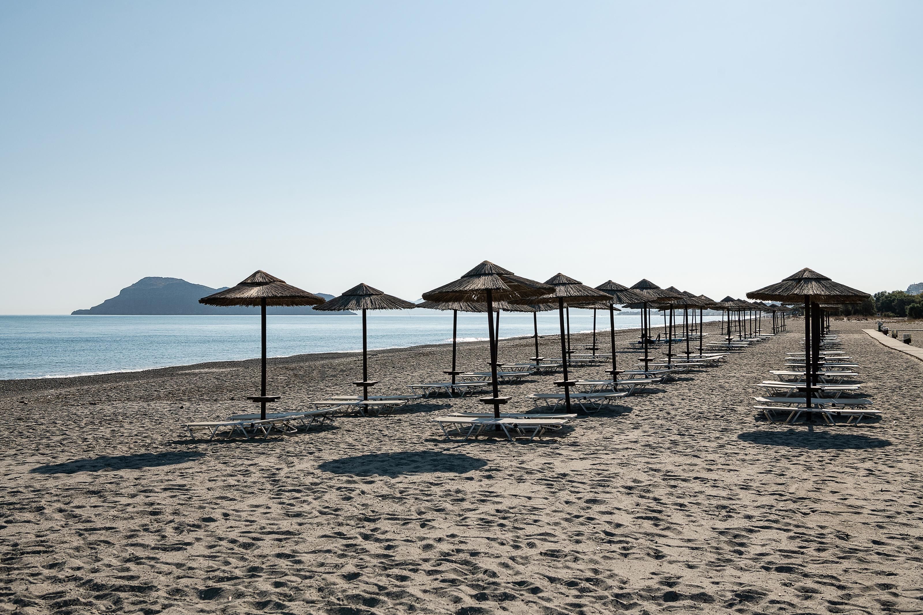 On the beach, sun-loungers, beach umbrellas, beach towels