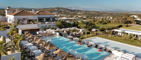Indoor pool, seasonal outdoor pool, pool umbrellas, sun loungers