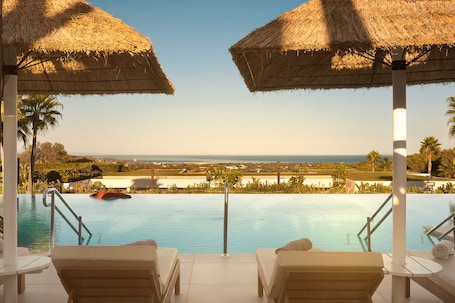 Indoor pool, seasonal outdoor pool, pool umbrellas, sun loungers