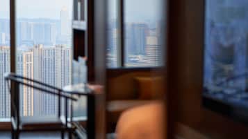 A modern interior with a view of high-rise buildings.