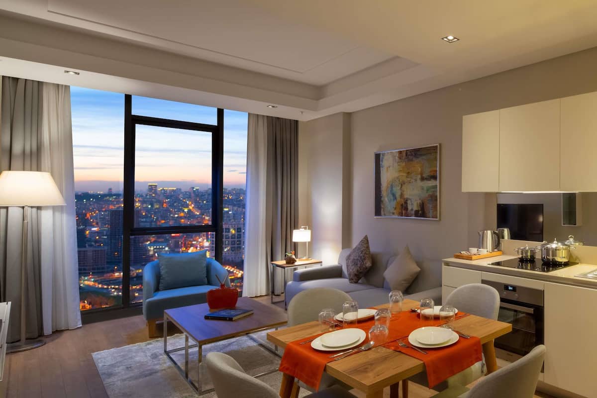 Deluxe Apartment, 1 Bedroom | In-room safe, desk, blackout drapes, iron/ironing board