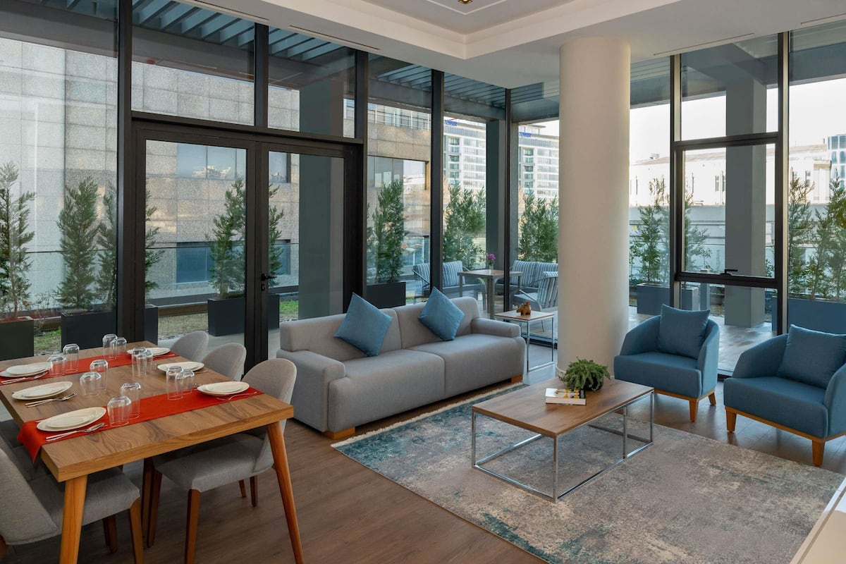 Apartment, 4 Bedrooms (Garden Villa) | In-room safe, desk, blackout drapes, iron/ironing board