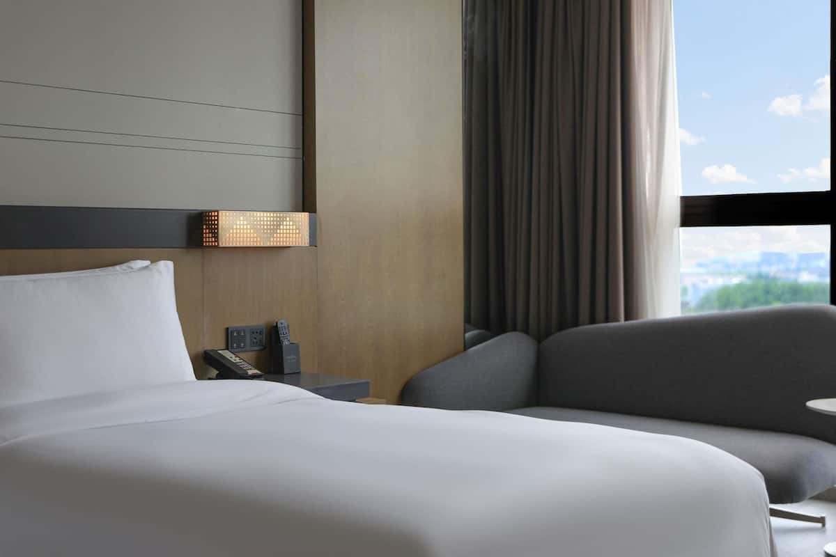 Premium bedding, pillow-top beds, free minibar, in-room safe