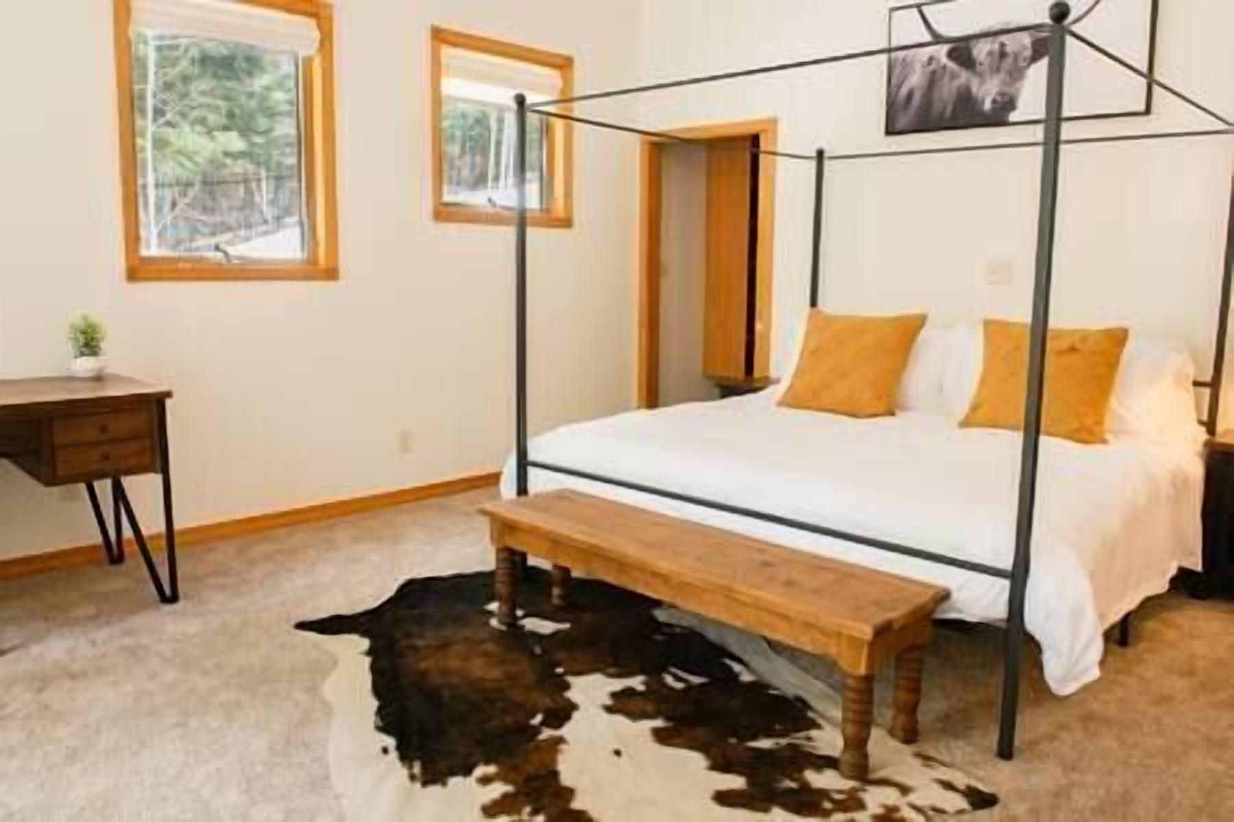 Mid-Level King Master: Work area, walk-in closet, and private patio access for added comfort.