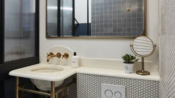 Shower, designer toiletries, hair dryer, towels