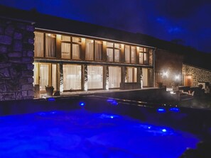 A building with a pool area, stone walls, and large windows. - 3 bedroom accommodation in South Tawton, near Okehampton (South Tawton, near Okehampton)