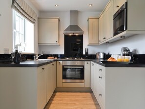 Oven, dishwasher, high chair, cookware/dishes/utensils