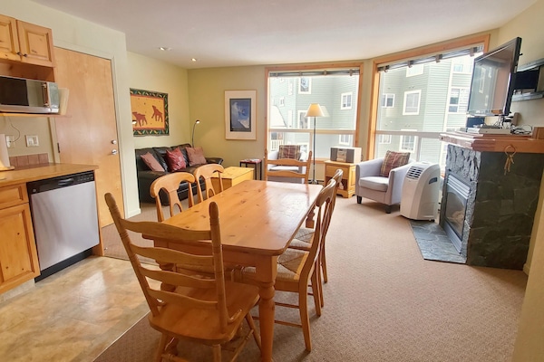Open plan kitchen, dining, and living