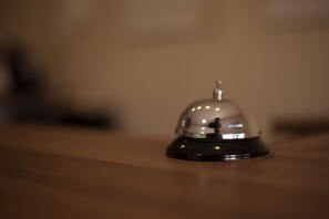 A bell on a wooden surface.